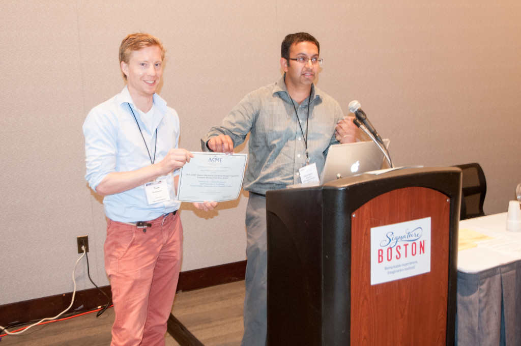 The 2015 Student Mechanism and Robot Design Competition award is handed to Teun by Girish Krishnan, the contest organizer